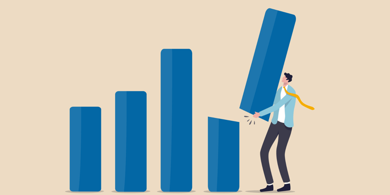 A man in a suit and tie changing the size of a stack of blocks in a visualisation of income smoothing.